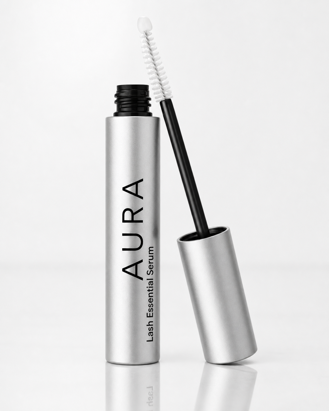 Aura Lash Essential Serum tube and brush close up