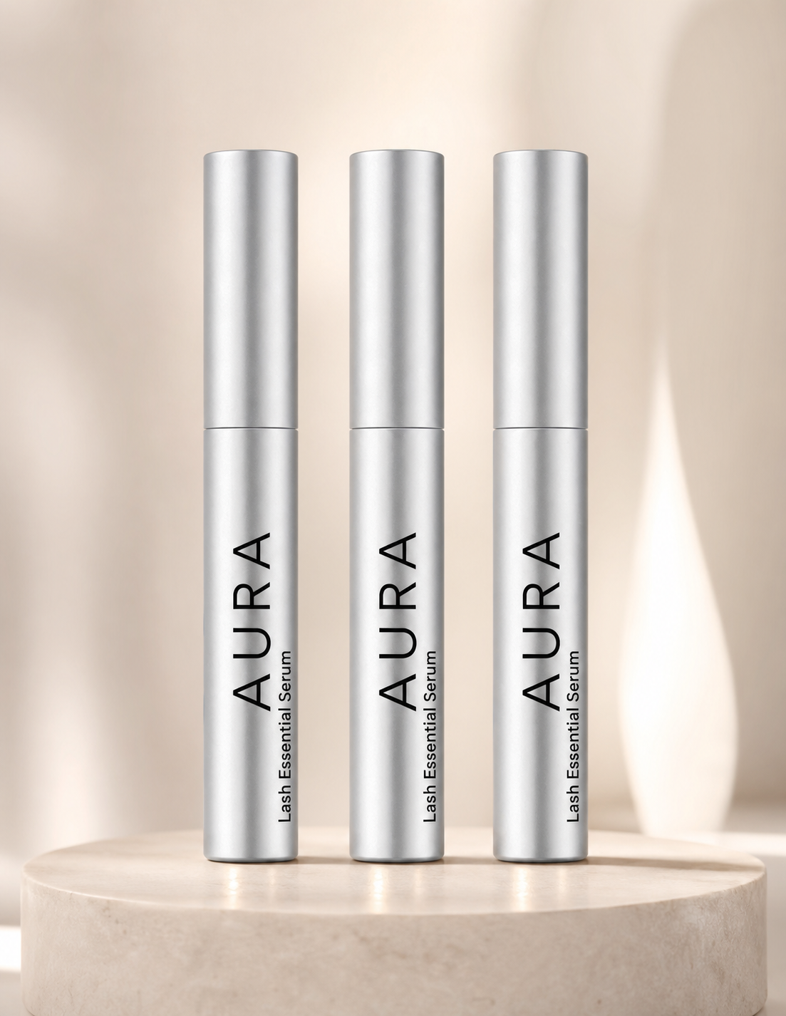 Three tubes of Aura Lash Essential Serum